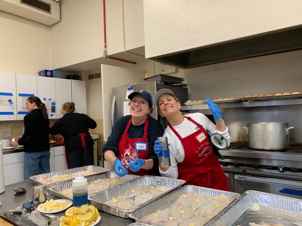 Eager volunteers bake fish for the Saint James Fish Fry.