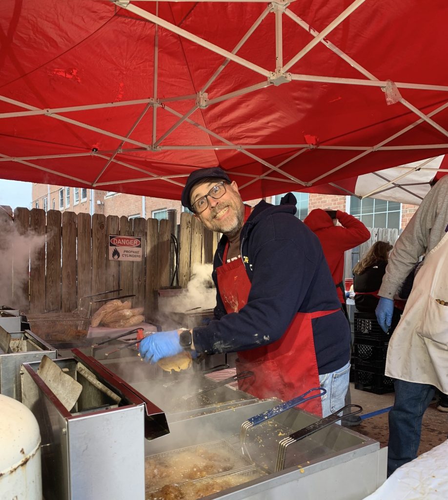 A Fryer fries fish for the Saint James Fish Fry.
