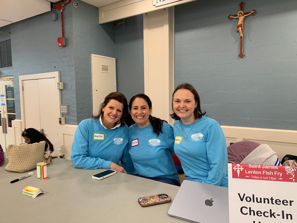 Coordinators eagerly await signing in volunteers.